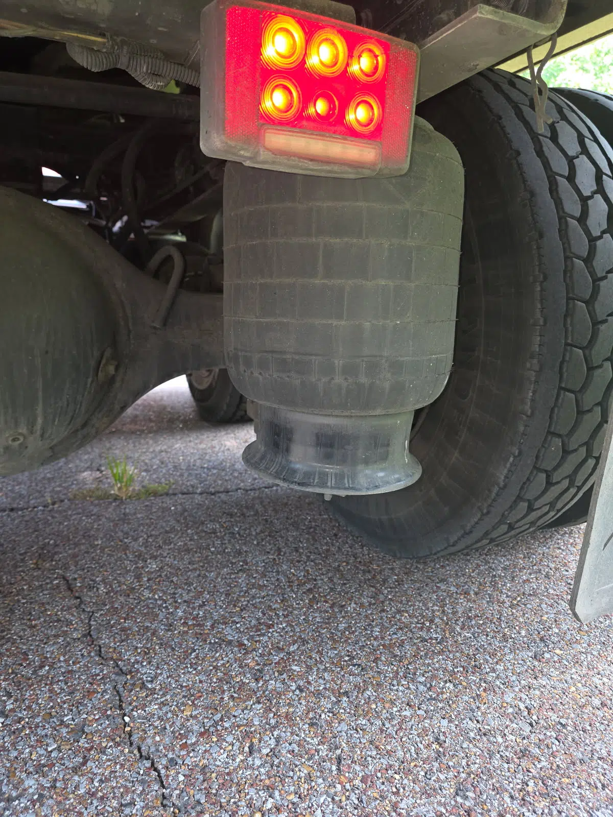 Air brake chamber and tail lights under a truck trailer — Rickey Alexander Mobile Truck & Trailer Repair in Forrest City